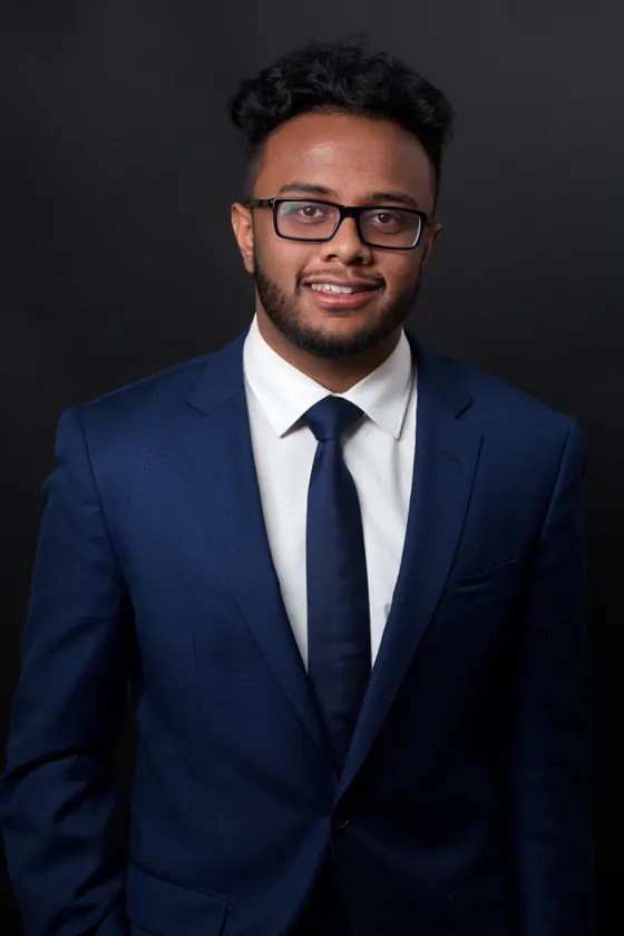 Team headshot on a charcoal backdrop