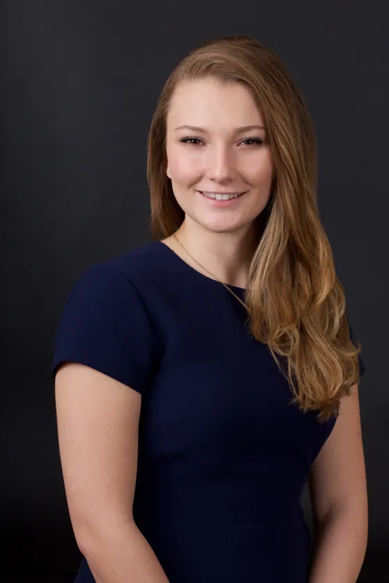 Team headshot on a charcoal backdrop