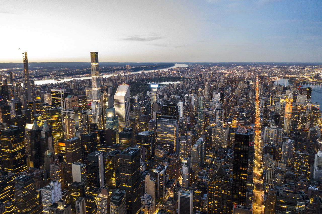 Aerial photography NYC — Manhattan skyline and Hudson River at dusk